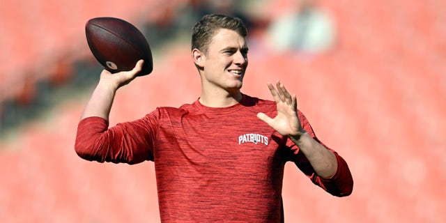 Mac Jones warms up before the New England Patriots game against the Browns at FirstEnergy Stadium on Oct. 16, 2022, in Cleveland, Ohio.