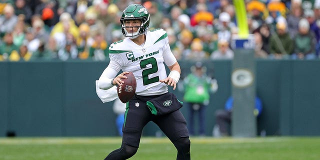 Zach Wilson #2 of the New York Jets looks to pass during a game against the Green Bay Packers at Lambeau Field on October 16, 2022, in Green Bay, Wisconsin. The Jets defeated the Packers 27-10. 