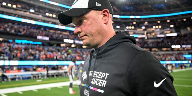 Head coach Nathaniel Hackett of the Denver Broncos walks off the field after the fourth quarter of the Los Angeles Chargers 19-16 overtime win at SoFi Stadium in Inglewood, California on Monday, October 17, 2022. 