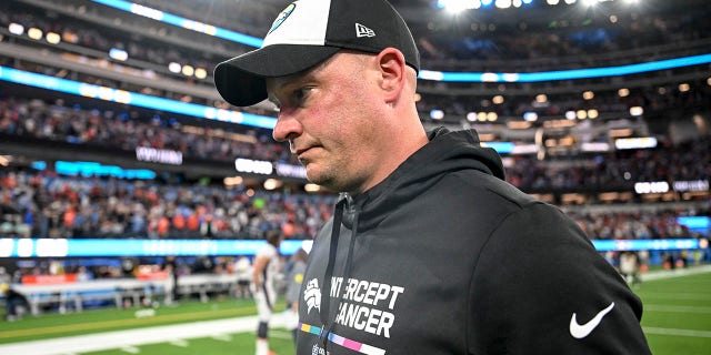 Head coach Nathaniel Hackett of the Denver Broncos walks off the field after the fourth quarter of the Los Angeles Chargers 19-16 overtime win at SoFi Stadium in Inglewood, California on Monday, October 17, 2022. 