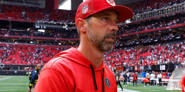 San Francisco 49ers head coach Kyle Shanahan leaves the field after a game against the Atlanta Falcons at Mercedes-Benz Stadium on October 16, 2022 in Atlanta.