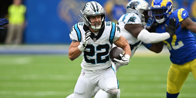 Christian McCaffrey, #22 of the Carolina Panthers, plays the ball while playing the Los Angeles Rams at Sophie Stadium on October 16, 2022 in Inglewood, California. 