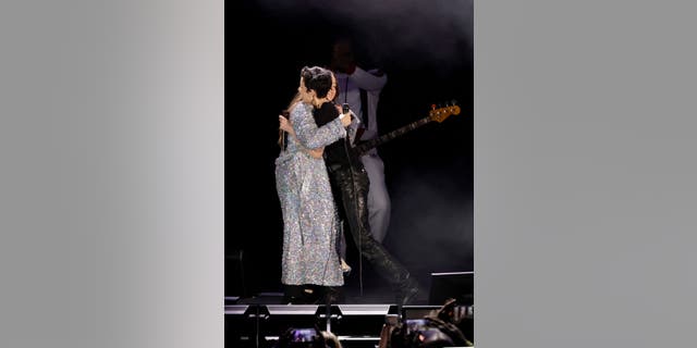 Alanis Morissette and Halsey perform hugged on stage at the Hollywood Bowl.
