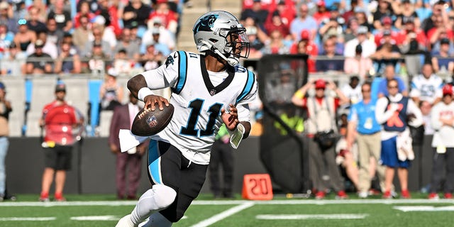 PJ Walker of the Carolina Panthers looks to pass in the fourth quarter against the Tampa Bay Buccaneers at Bank of America Stadium Oct. 23, 2022, in Charlotte, N.C. 