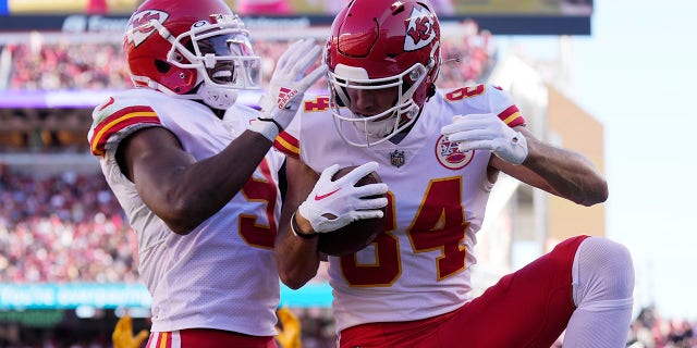 Kansas City Chiefs' Justin Watson, right, celebrates with JuJu Smith-Schuster after catching a touchdown pass against the San Francisco 49ers on Oct. 23, 2022.