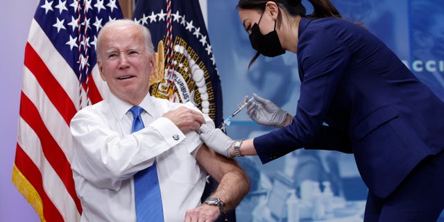 U.S. President Joe Biden receives his updated COVID-19 booster in the South Court Auditorium at the White House campus on October 25, 2022, in Washington, DC. Biden delivered remarks on the status of Covid-19 in the United States. 