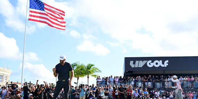 Dustin Johnson celebrates making his winning putt during the team championship round of the LIV Golf Invitational - Miami on October 30, 2022, in Doral, Florida.