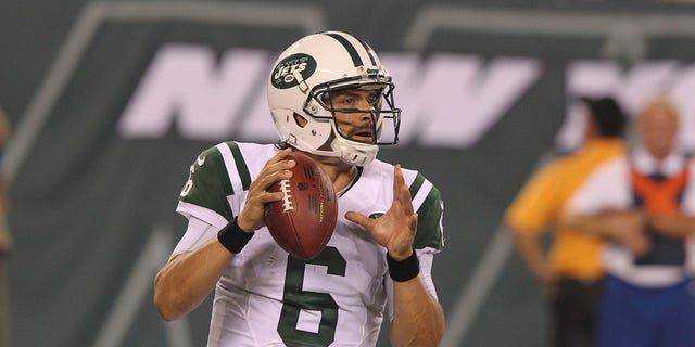 Quarterback Mark Sanchez, #6, of the New York Jets, drops to pass against the Jacksonville Jaguars at MetLife Stadium on August 17, 2013, in East Rutherford, New Jersey.  