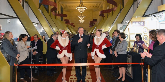 From left to right, Rockette Mindy Moeller, Randy Merritt and Rockette Mary Cavett attend the ribbon ceremony for the 2013 Grand Central Terminal Holiday Fair at Vanderbilt Hall at Grand Central Terminal on Nov. 18, 2013, in New York City.