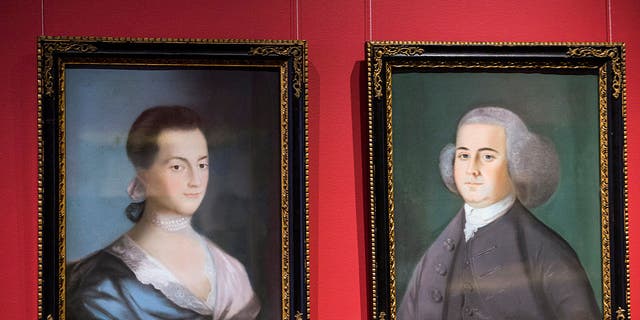 Paintings of former U.S. President John Adams, right, and his wife Abigail Adams, are displayed at the Massachusetts Historical Society in Boston, Massachusetts, on Monday, June 29, 2015. Here in acid-free, low-humidity stacks are 13 million pages of the personal letters and diaries of men and women who helped create the world we live in. They were the first president and first lady to live in the White House.