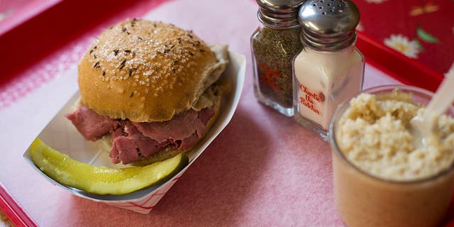 Charlie Roesch serves up his signature beef on weck sandwich at Charlie the Butcher in Buffalo, New York.