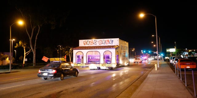 The original Taco Bell restaurant, located in Downey, was moved via truck to the company's headquarters in Irvine. The first location of the massive fast food chain closed long ago, but the company wanted to preserve the building. A truck carries the restaurant, known as ''Numero Uno,'' down Firestone Blvd. in Downey, Calif., in Nov. 2015.