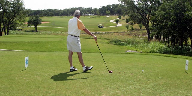 A golfer stands in the tee box at the Avery Ranch Golf Club in Austin, Texas. 