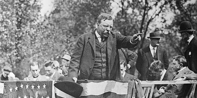 On this historic day, October 27, 1858, Teddy Roosevelt, American titan, was born in New York 2 Theodore Roosevelt standing on a podium pointing to the crowd during a campaign rally speech. California. 1900.