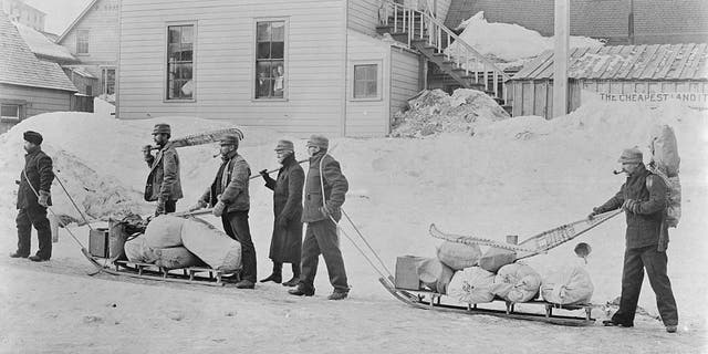 Alaska Gold Rush. Starting for the Yukon from Juneau, Alaska. Photograph by Winter and Pond, 1896.