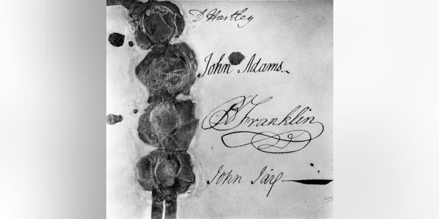 Photograph of the signatures and seals of the 1783 Treaty of Paris, the agreement that formally ended the American Revolutionary War between Great Britain and the North American colonies, in Paris, September 3, 1783. From the top, the signatures are of English politician David Hartley (1731-1813), representative of Britain; and American politicians John Adams (1735-1826), Benjamin Franklin (1706-1790) and John Jay (1745-1829).