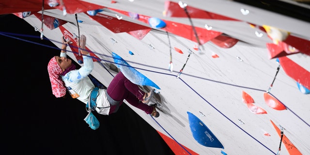 Iranian Elnaz Rekabi competes in the Women's Lead qualification at the 2016 Indoor Climbing and Paraclimbing World Championships at the Accor Hotels Arena in Paris on 14 September 2016. 