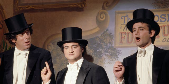 Rob Schneider said that Bill Murray mightiness  person  "hated" Chris Farley due to the fact that his "out of control" behaviour  reminded the histrion  of his precocious   person  and "SNL" co-star John Belushi. Elliott Gould, left, Belushi, center, and Murray, right, are pictured successful  1977.