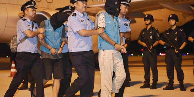 Suspects in telecoms scams are brought back to China from Cambodia as the CCP cracks down on fraud committed by its citizens overseas.