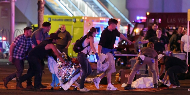 A crowd flees a shooting at the Route 91 Harvest festival shooting on Oct. 1, 2017.