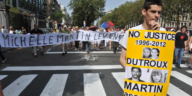People protest on Aug. 19, 2012, against a court decision to grant parole to the ex-wife and accomplice of Belgian pedophile and serial killer Marc Dutroux. The demonstration was the latest in a series of protests following a court ruling to free Michelle Martin, who served 16 years of her 30-year sentence.