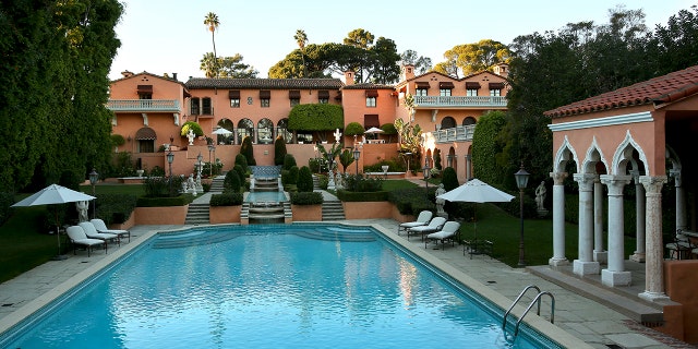 The two-house, five-acre Beverly Hills estate, the onetime residence of newspaper czar William Randolph Hearst and his girlfriend, actress Marion Davies, was priced at $135 million. The compound centers on a 50,000-square-foot mansion built in the 1920s and retains intricately carved ceilings and paneled walls, a garden-view bar and a two-story library with hand-carved woodwork, much from Hearst's castle at San Simeon. 