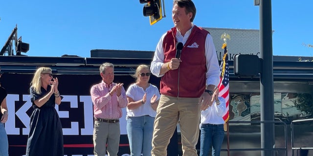 Republican Gov. Glenn Youngkin of Virginia speaks on behalf of GOP Gov. Brian Kemp of Georgia at a Kemp re-election rally on Sept. 27, 2022, in Alpharetta, Georgia