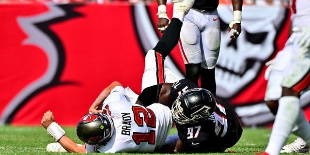 Grady Jarrett #97 of the Atlanta Falcons sacks Tom Brady #12 of the Tampa Bay Buccaneers during the fourth quarter of the game at Raymond James Stadium on Oct. 9, 2022 in Tampa, Florida.