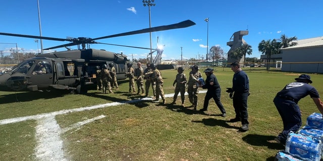 Guards unloaded water and food onto Pine Island.