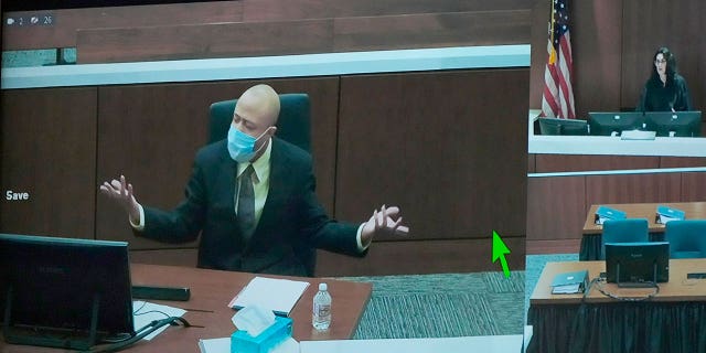 Darrell Brooks appears via video from an adjacent courtroom after being removed by Judge Jennifer Dorow for continuous interruptions in a Waukesha County Circuit Court during jury selection in Waukesha on Monday, Oct. 3, 2022.
