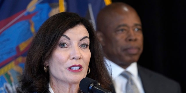 New York Governor Kathy Hochul speaks, joined by New York City Mayor Eric Adams (R) and the newly appointed ATF Director Steve Dettelbah, as she delivers remarks about their joint effort to combat gun violence at the High Intensity Drug Trafficking Areas (HIDTA) office on August 24, 2022 in New York City.