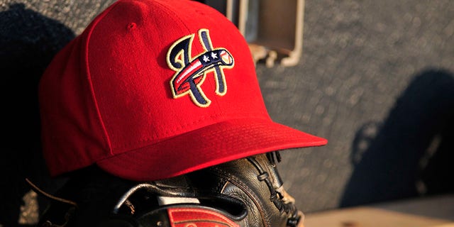 Harrisburg Senators baseball hat and baseball glove sit in the dugout before a game with the Akron Aeros on Aug. 18, 2011 at Canal Park in Akron, Ohio.