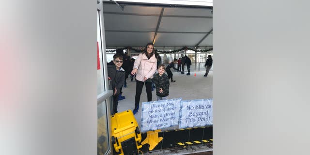 Kim Hoffman and her sons at skating.