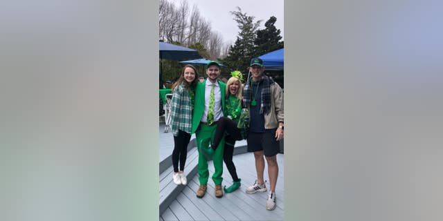 Photo shows Kyle Mullen, his mother, and loved ones at a St. Patrick's Day party on March 17, 2021.