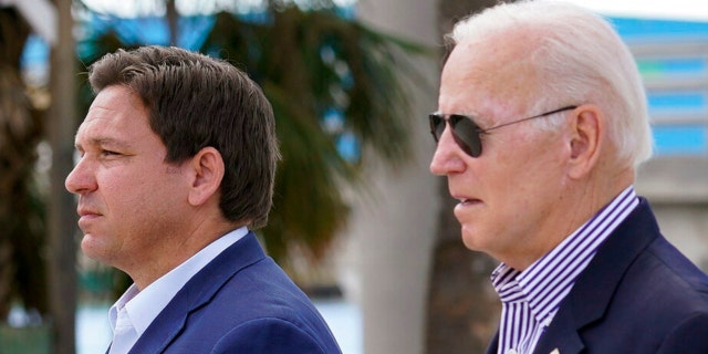 President Biden and Gov. Ron DeSantis arrive to tour an area impacted by Hurricane Ian on Wednesday, Oct. 5, 2022, in Fort Myers Beach, Florida.