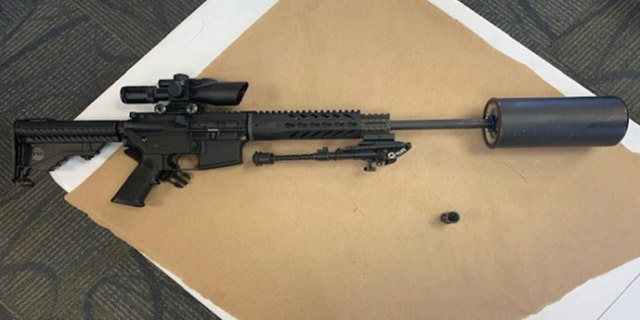 An image in the federal complaint described as showing a "Sig Sauer M400 300 Blackout Rifle with Oil Filter-type Silencer Attached to Barrel using Oil Filter Adapter."