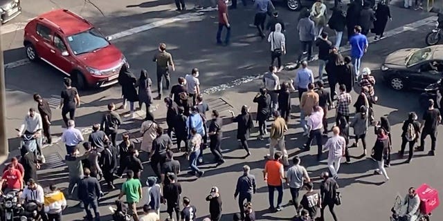 People blocking an intersection in Iran as protesters marked a symbolic 40 days since 22-year-old Mahsa Amini died in custody and ignited the biggest anti-government movement in over a decade.