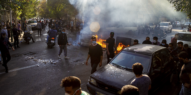 Iranians protest the death of Mahsa Amini after she was arrested by the Morale Police, in Tehran on October 27, 2022. 