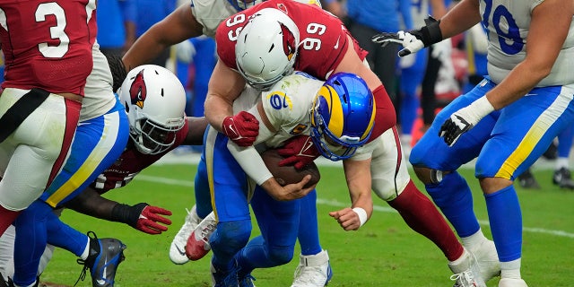 Arizona Cardinals defensive end J.J. Watt (99) sacks Los Angeles Rams quarterback Matthew Stafford (9) during the second half of an NFL football game, Sunday, Sept. 25, 2022, in Glendale, Ariz.
