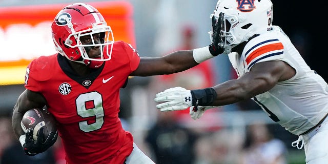 AP Top 25 poll: Shake-up in top spots; James Madison enters rankings for first time 3 Georgia wide receiver Jackson Meeks (9) tries to fight off Auburn linebacker Owen Pappoe (0) after a catch during the second half of a game Saturday, Oct. 8, 2022, in Athens, Ga.