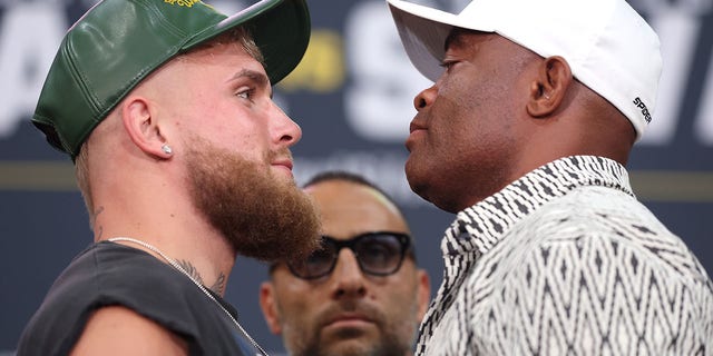 Jake Paul, left, and Anderson SIlva face off during a press conference at Gila River Arena Sept. 13, 2022, in Glendale, Ariz.