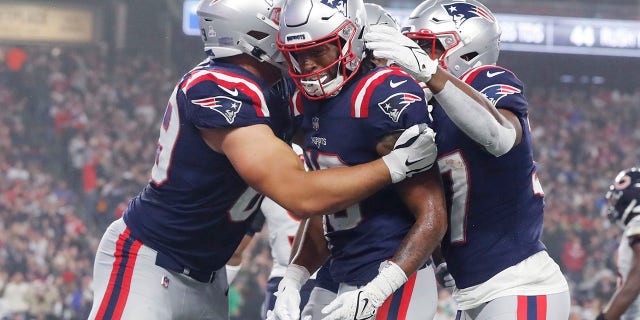 New England Patriots wide receiver Jacobi Myers (center) is congratulated after scoring a touchdown in the first half of an NFL football game against the Chicago Bears on Monday, Oct. 24, 2022 in Foxborough, Massachusetts. .