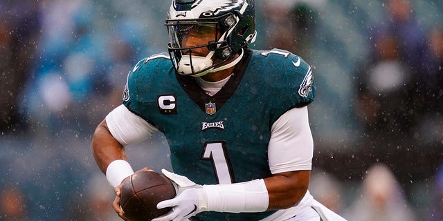 The Philadelphia Eagles' Jalen Hurts warms up before a game against the Jacksonville Jaguars Sunday, Oct. 2, 2022, in Philadelphia. 