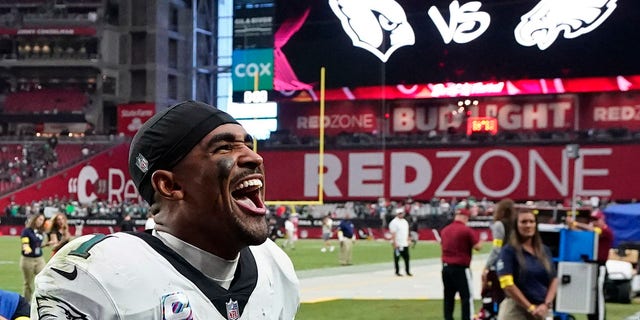 Philadelphia Eagles quarterback Jalen Hurts celebrates after defeating the Cardinals, Sunday, Oct. 9, 2022, in Glendale, Arizona.