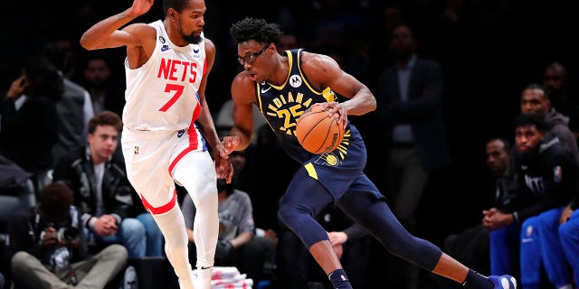 Indiana Pacers forward Jalen Smith drives against Brooklyn Nets forward Kevin Durant, Saturday, Oct. 29, 2022, in New York.