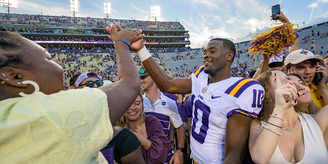 LSU wide receiver Jaray Jenkins (10) celebrates with fans who came onto the field after LSU defeated Mississippi in an NCAA college football game in Baton Rouge, La., Saturday, Oct. 22, 2022. 