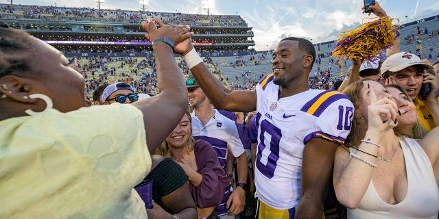 LSU wide receiver Jaray Jenkins (10) celebrates with fans who came onto the field after LSU defeated Mississippi in an NCAA college football game in Baton Rouge, La., Saturday, Oct. 22, 2022.