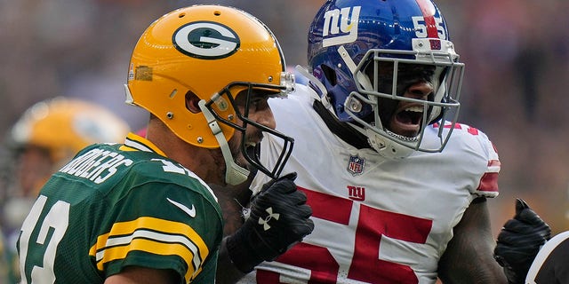 New York Giants linebacker Jihad Ward reacts after Green Bay Packers quarterback Aaron Rodgers failed to make a first down at the Tottenham Hotspur stadium in London, Sunday, Oct. 9, 2022.