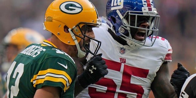 New York Giants linebacker Jihad Ward reacts after Green Bay Packers quarterback Aaron Rodgers failed to make a first down at the Tottenham Hotspur stadium in London, Sunday, Oct. 9, 2022.