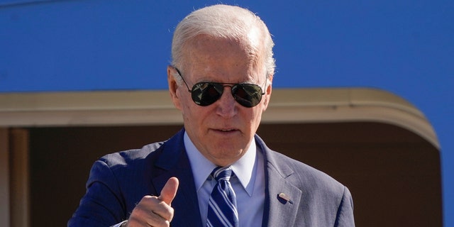 President Biden gives a thumbs-up as he boards Air Force One at Andrews Air Force Base, Maryland, Thursday, Oct. 20, 2022, en route to Pennsylvania.